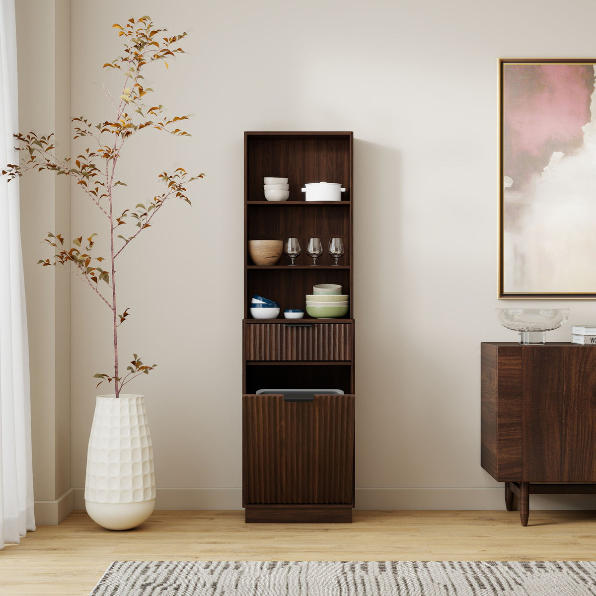 Tall dark brown fluted storage cabinet with open shelves and a lower trash bin compartment.