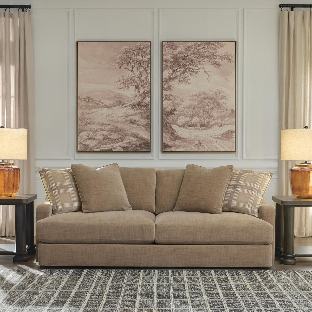 Beige fabric sofa with cushioned arms and plaid and solid throw pillows