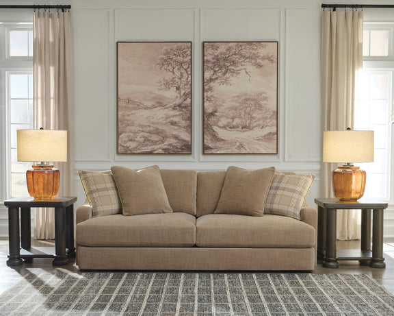 Beige fabric sofa with cushioned arms and plaid and solid throw pillows