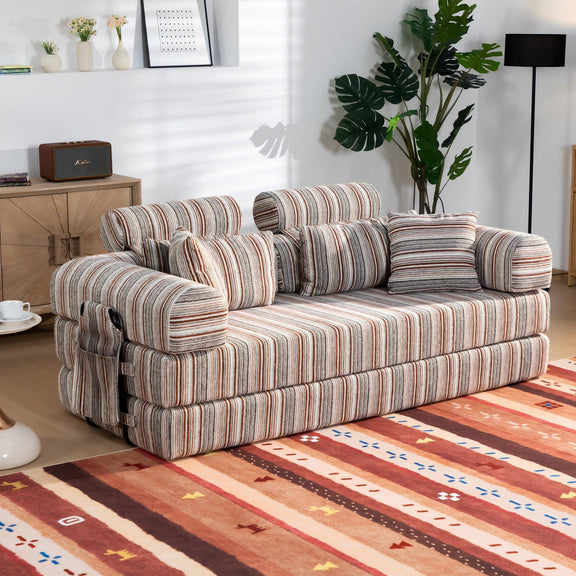 Sleeper sofa bed with striped upholstery and bundled back cushions, lounge-ready angle