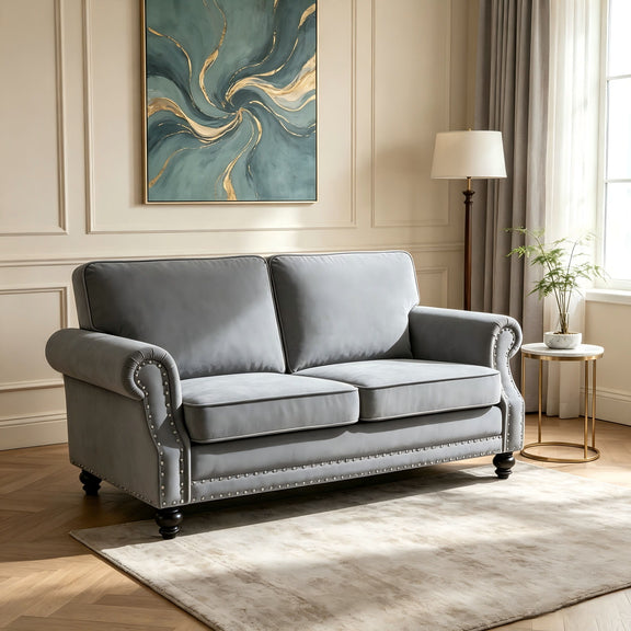 Light gray 2-seat loveseat sofa with nailhead trim and turned legs, tufted arms