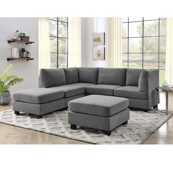 Upholstered modular sectional sofa in dark gray with corner and ottoman chaise