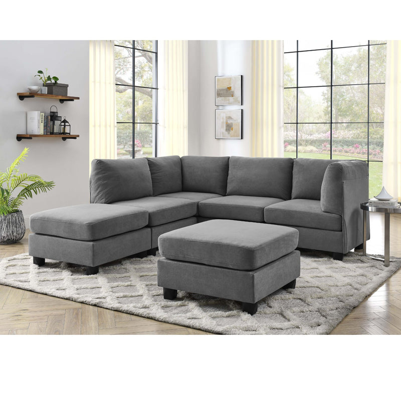Upholstered modular sectional sofa in dark gray with corner and ottoman chaise
