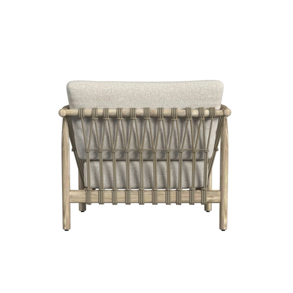 Outdoor accent chair rear view with woven rope back and light taupe upholstered cushion