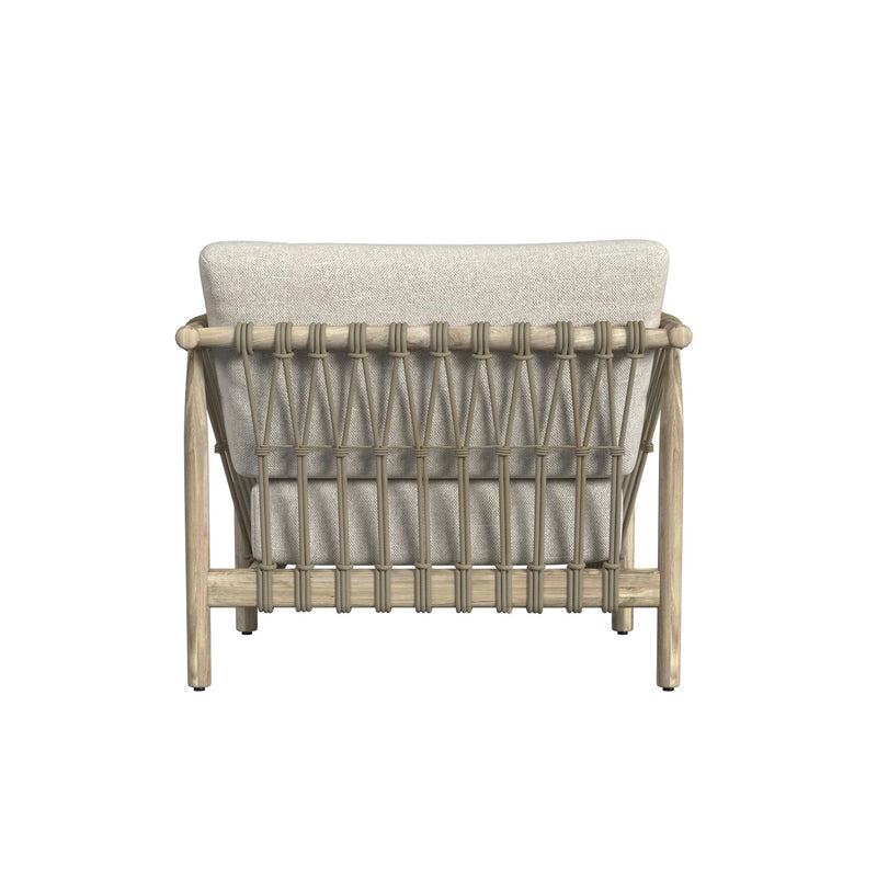 Outdoor accent chair rear view with woven rope back and light taupe upholstered cushion