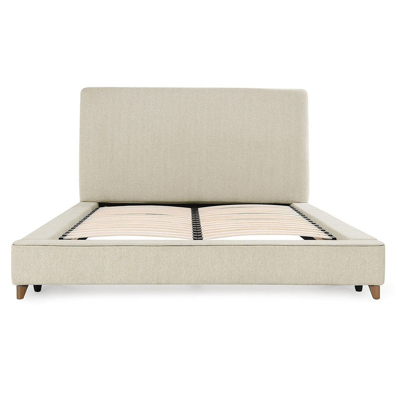 Upholstered oatmeal platform bed with square headboard and striped mattress