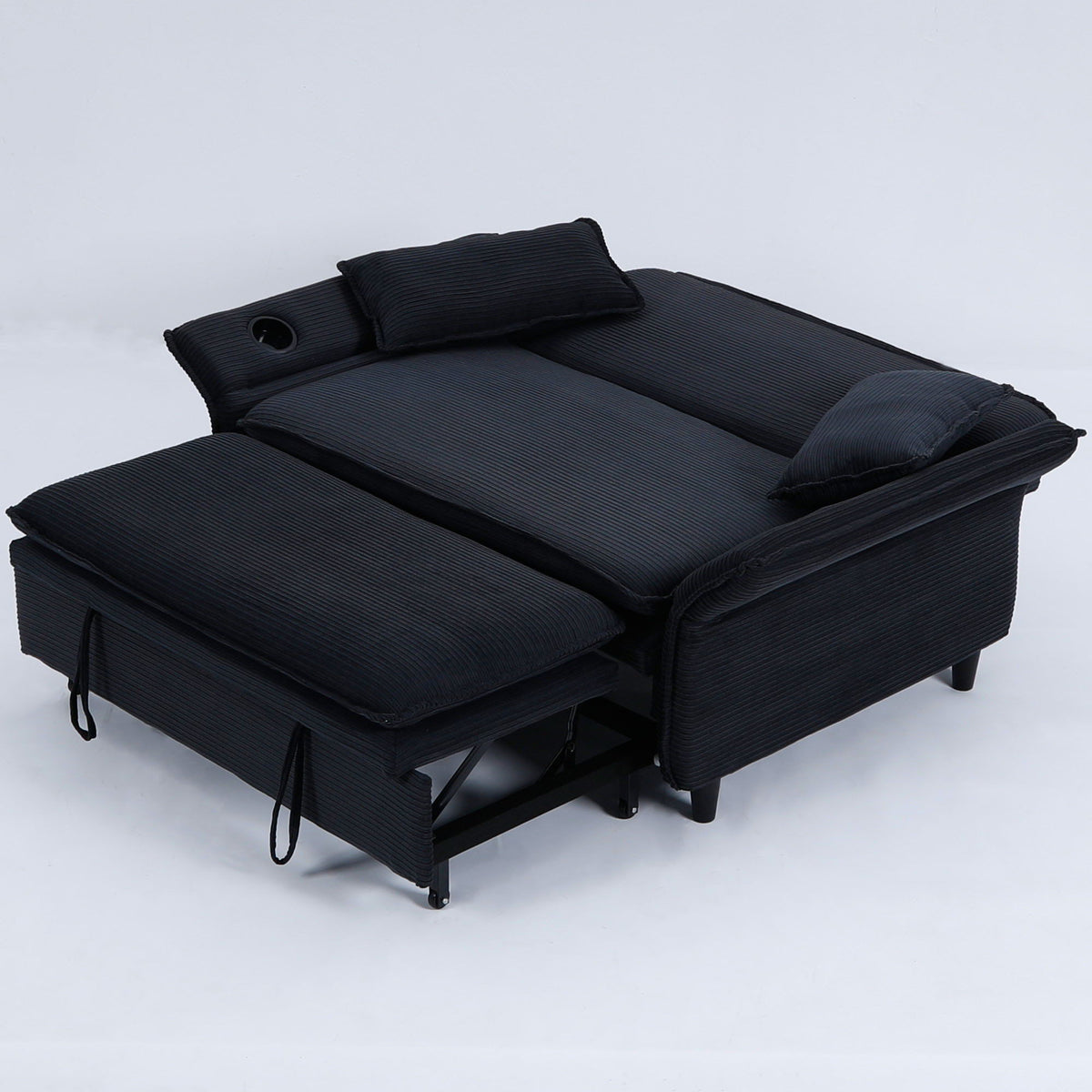 Black fabric sofa bed with adjustable backrests and rounded armrest cutouts, folded out