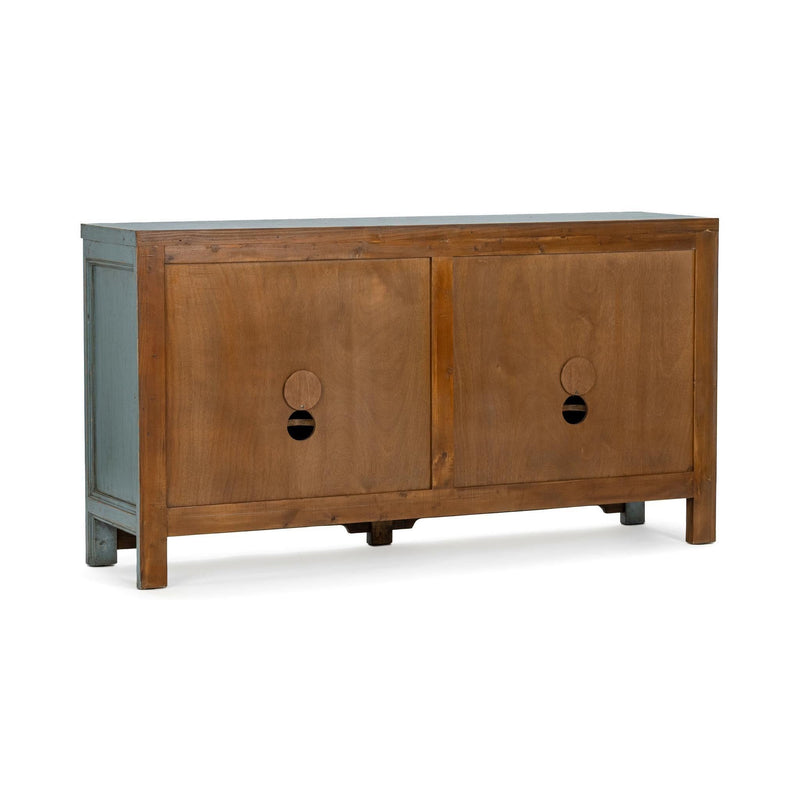 Wood cabinet with two panel doors and oval cutout pulls, standing on short legs