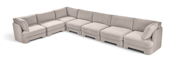 Velvet sectional sofa in light beige with square arms and plush seat cushions