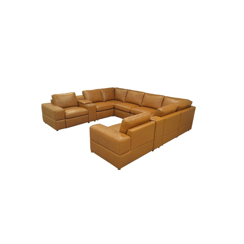 Light brown modular sectional sofa with large square arms and chaise-style ottoman