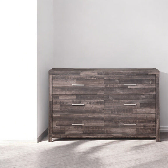 Dark brown dresser with six drawers, silver bar pulls; front view