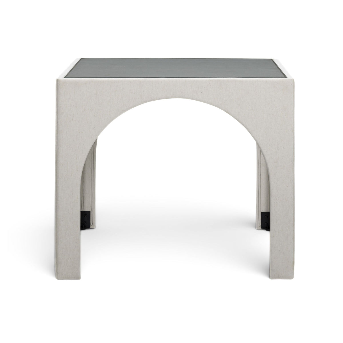 Beige upholstered game table with arched cutout and dark corner feet