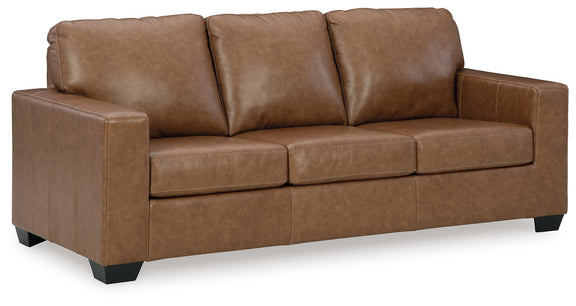Brown upholstered sofa with three seat sections and upright back cushions