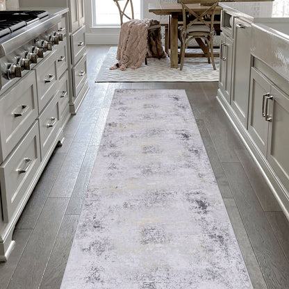 Washable gray runner rug with distressed white speckled texture, long and narrow.