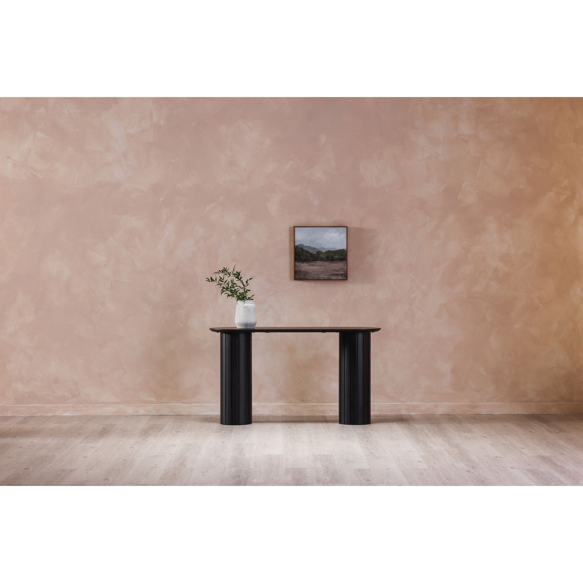 Black console table with oval top and two fluted pedestal legs