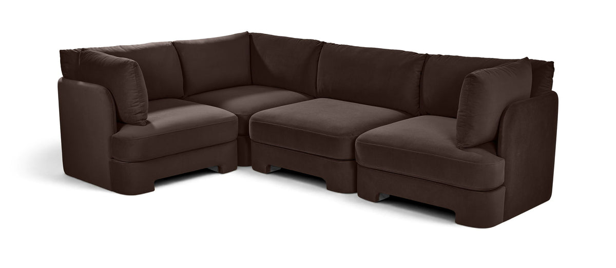 Dark brown velvet sectional sofa with upholstered arms, chaise corner, and matching cushions