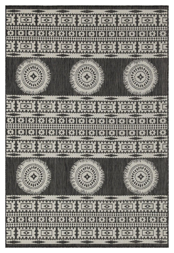 Dark gray polypropylene area rug with white tribal stripes and medallion circles
