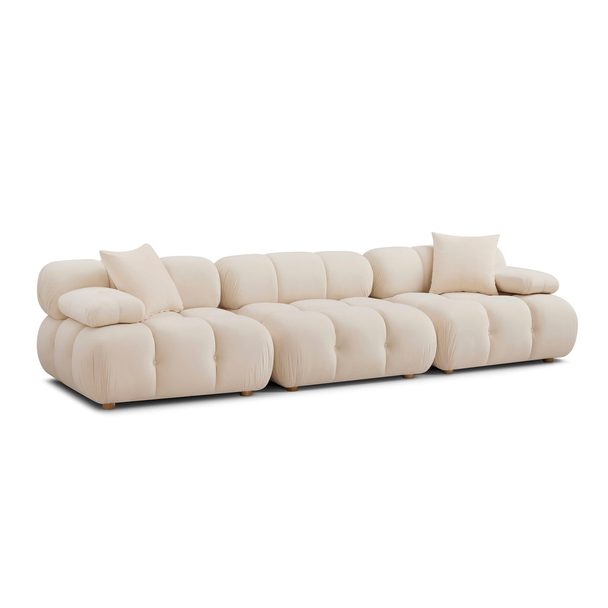 Cream modular sofa with deep seat cushions and rounded tufted backrest