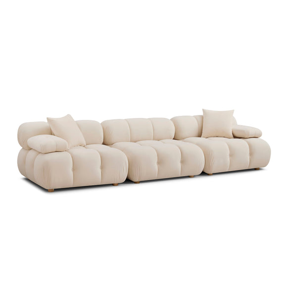Cream modular sofa with deep seat cushions and rounded tufted backrest