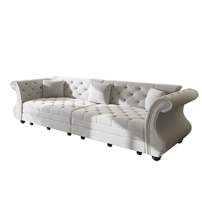 Cream tufted pull-out sofa bed with curved roll arms and cushioned back