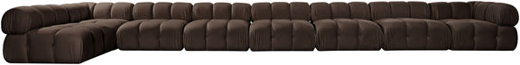 Dark brown velvet L-shaped sectional sofa with tufted cushions and rounded arms.