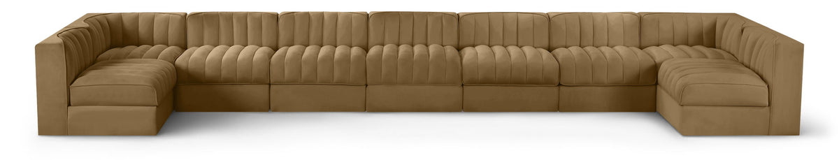 Light brown velvet modular sectional sofa with tufted cushions and curved armrests