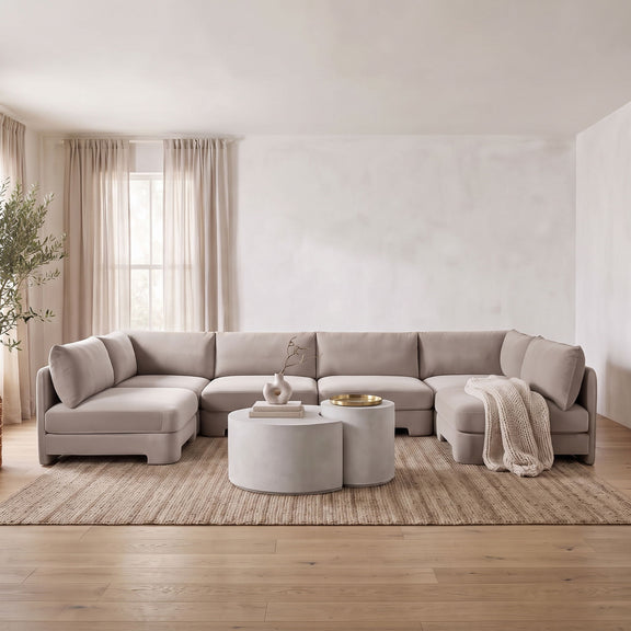 U-shaped armless sectional sofa in light gray velvet with modular ottoman-style sections