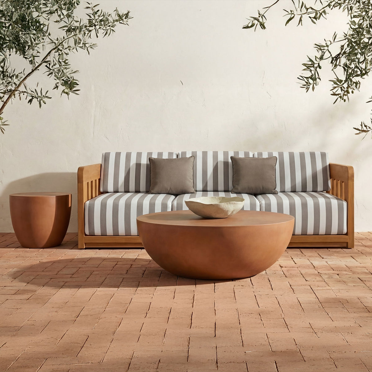 Terracotta round coffee table with low, wide bowl profile