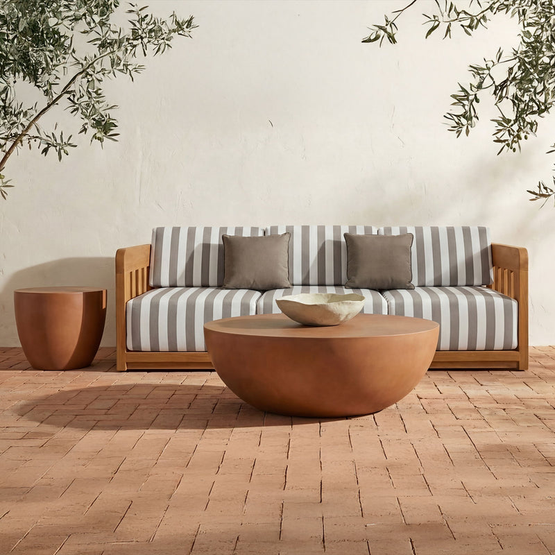Terracotta round coffee table with low, wide bowl profile