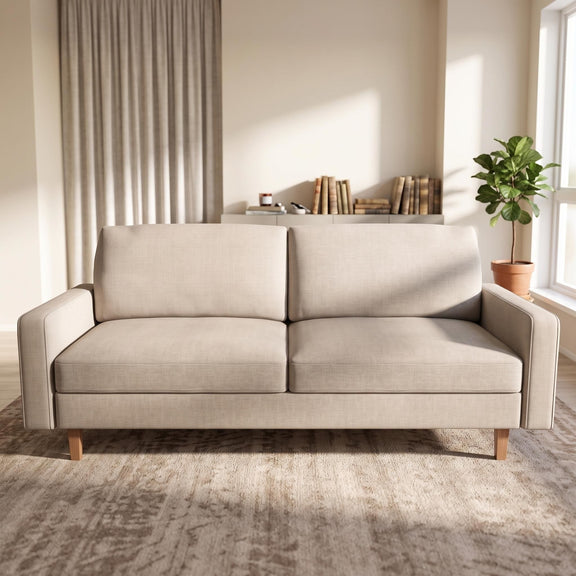 Three-seat beige fabric sofa with two seat cushions, squared arms, and tapered wood legs