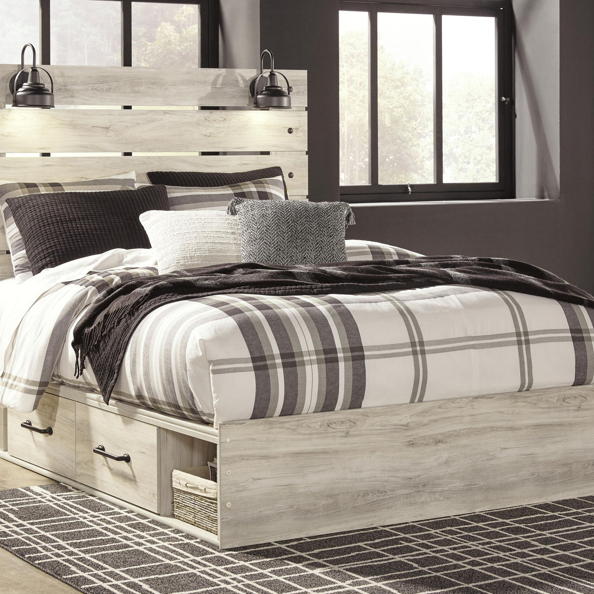 Panel bed with side drawers and light beige wood finish, white-and-black striped bedding set