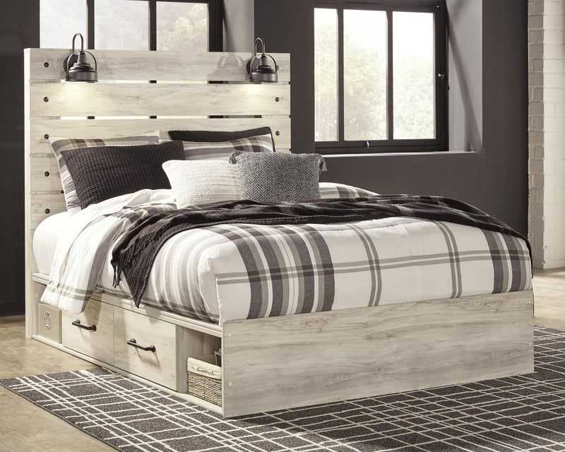 Panel bed with side drawers and light beige wood finish, white-and-black striped bedding set
