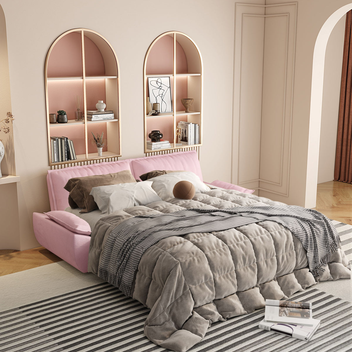 Pink sofa bed with pull-out mattress topped with gray and white bedding