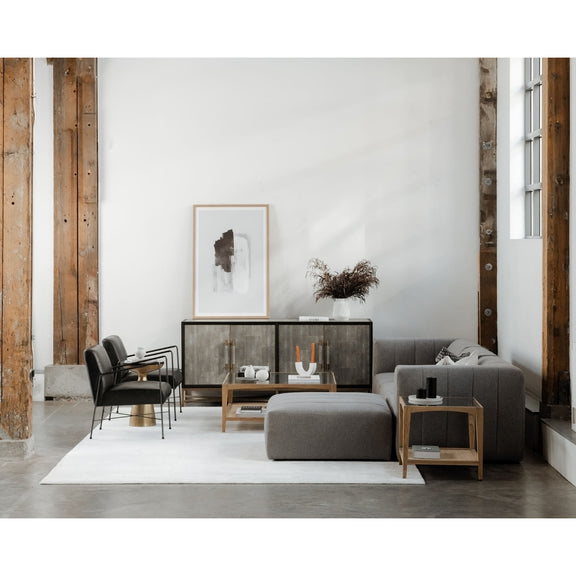 Natural wood coffee table with glass top and open lower shelf in living room