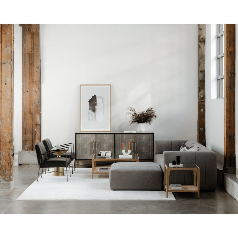 Natural wood coffee table with glass top and open lower shelf in living room