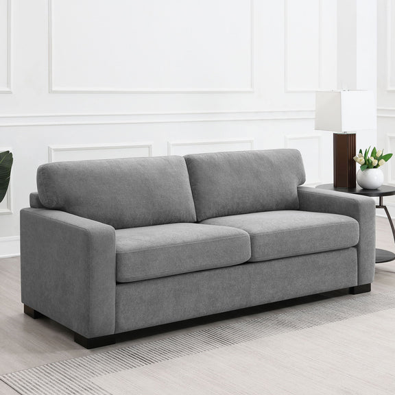 Gray fabric sleeper sofa with plush back cushions, rolled arms, and black feet