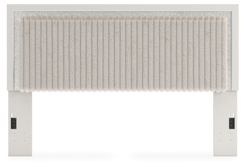 Upholstered panel headboard with white ribbed fabric and light frame, full front view