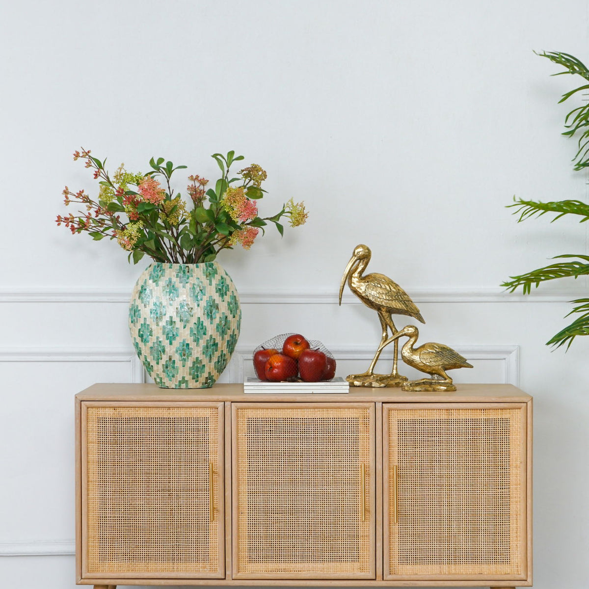 Three-door wooden TV cabinet with woven panels and tapered legs