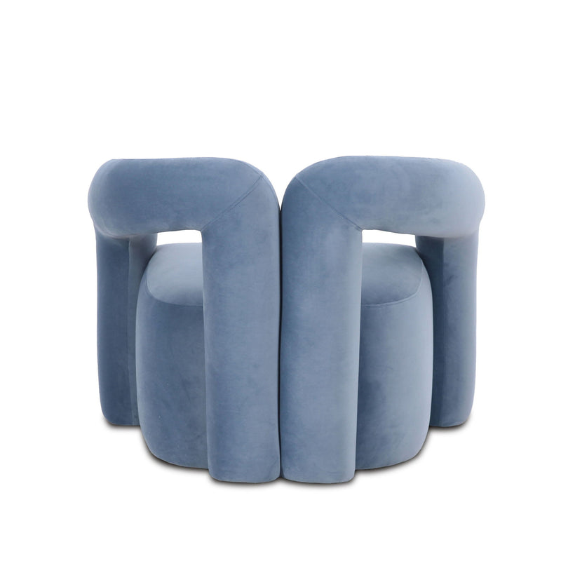 Blue accent chair with tall rounded arms and upholstered back opening