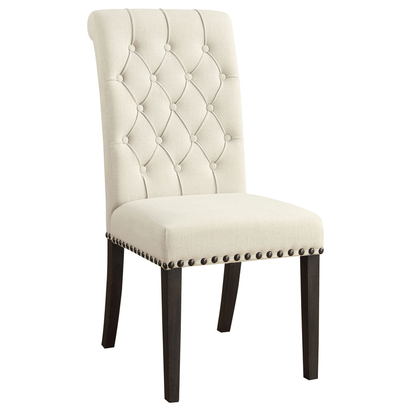 Beige tufted rolled backrest side chair with nailhead trim and dark wooden legs