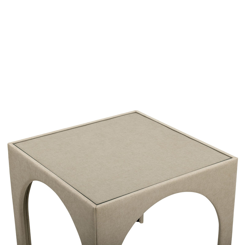 Beige upholstered game table with square top and rounded arched side openings