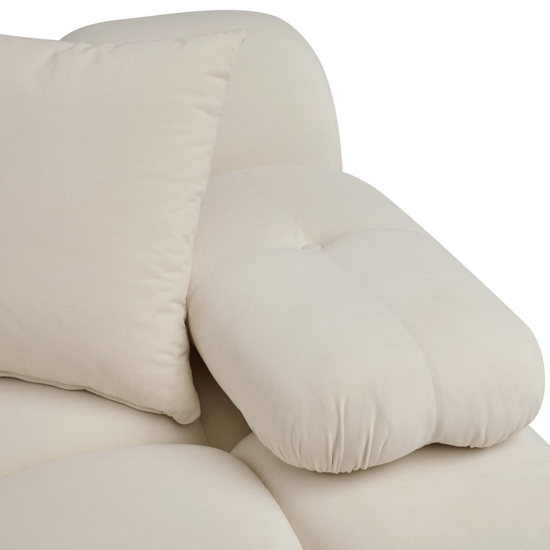 Close-up of cream sofa cushion with padded seams and soft rounded edges