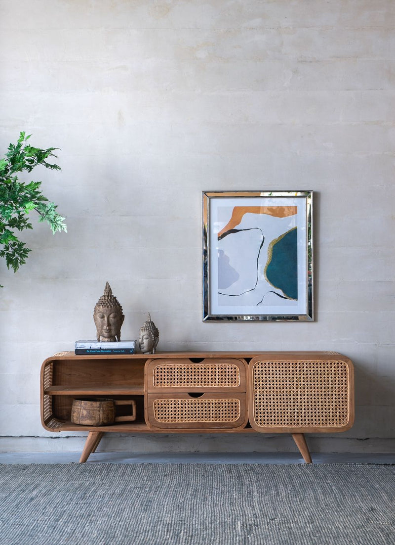 Natural teak cabinet with cane-front drawers, an open shelf, and a cabinet door on tapered legs