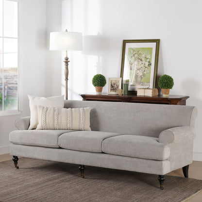 Three-cushion tightback sofa in light gray with rolled arms and tapered legs