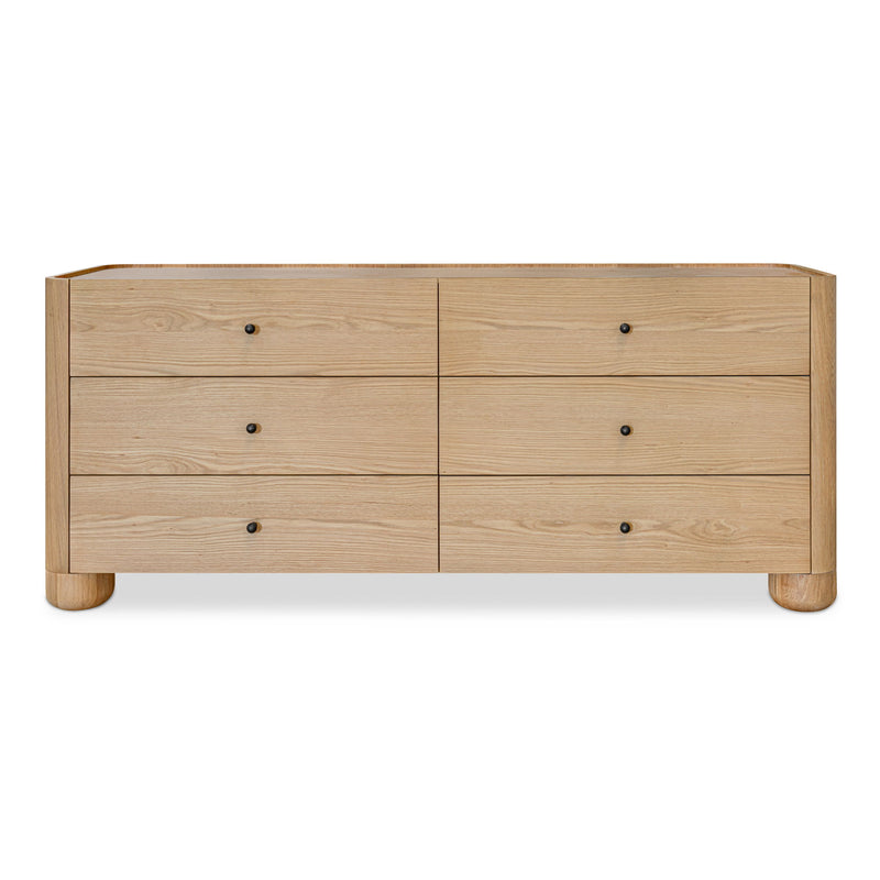 Light brown Gibson dresser with six drawers, small dark knobs, and rounded feet