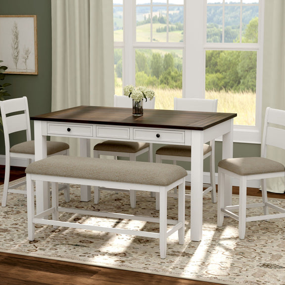 White dining table with dark top, beige bench seat and two matching chairs