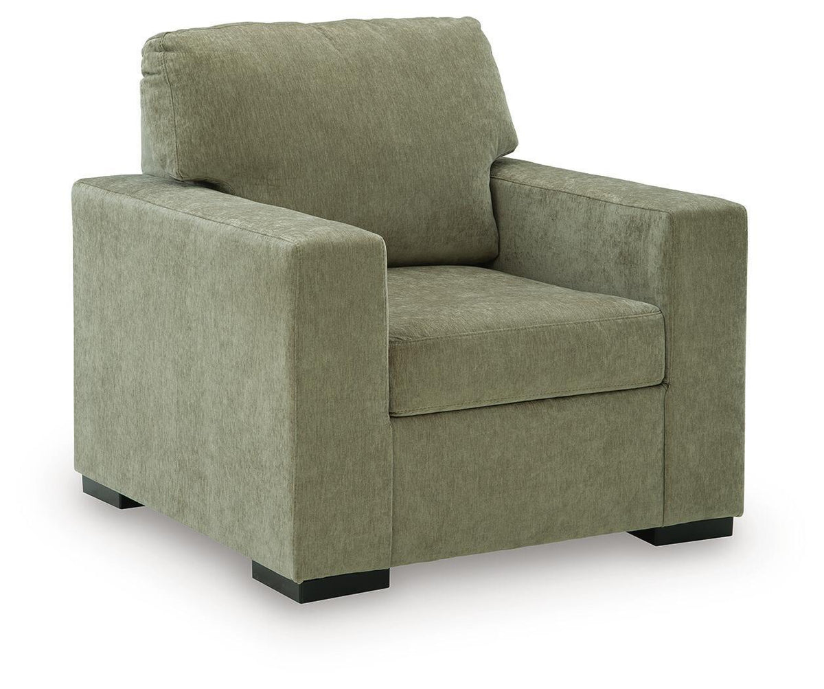 Moss green upholstered armchair with square arms and thick back cushion