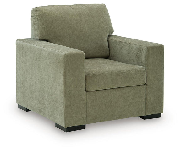 Moss green upholstered armchair with square arms and thick back cushion
