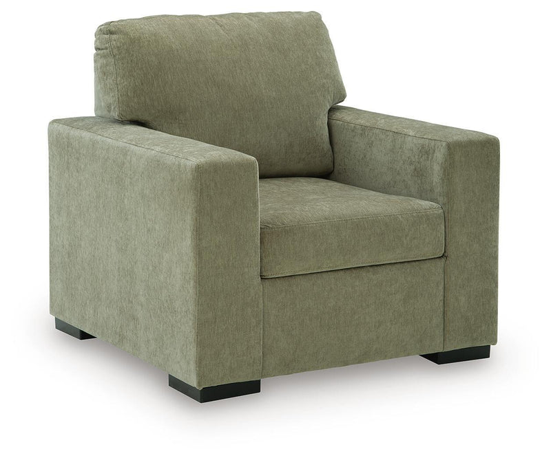 Moss green upholstered armchair with square arms and thick back cushion