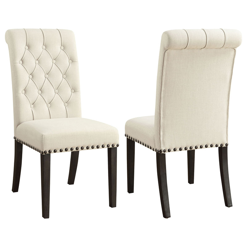 Set of 2 beige tufted rolled backrest side chairs with nailhead trim and wood legs